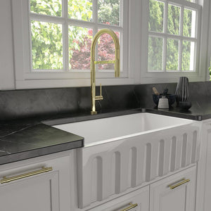 ZLINE Incline Pull Down Single Handle Kitchen Faucet in Polished Gold (INC-KF-PG) in a cottage-style kitchen.