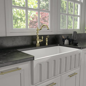 ZLINE Rembrandt Single Handle Kitchen Faucet and Side Sprayer in Polished Gold (REM-KF-PG) in a farmhouse kitchen.