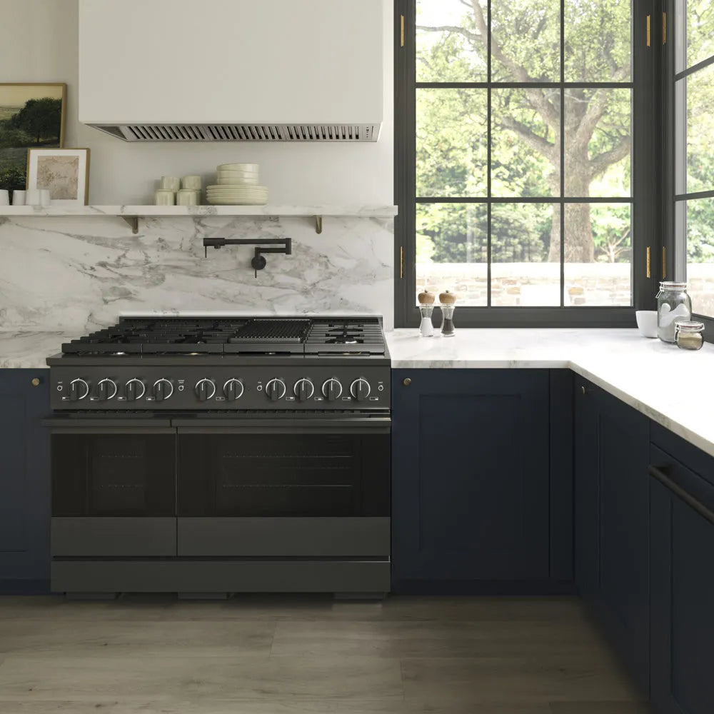 ZLINE 48 in. 6.7 cu. ft. Marino Double Oven Dual Fuel Range with 8 Burner Gas Cooktop in Black Stainless Steel (MDRB-48) front, in a modern kitchen set under a white marble backsplash and a large black-framed window with a view of green trees outside.