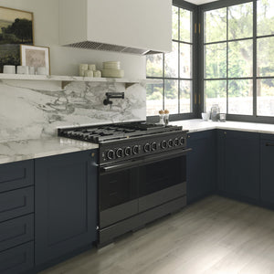 ZLINE 48 in. 6.7 cu. ft. Marino Double Oven Gas Range with 8 Burner Cooktop in Black Stainless Steel (MGRB-48) side, in a modern kitchen set under a white marble backsplash and a large black-framed window with a view of green trees outside.