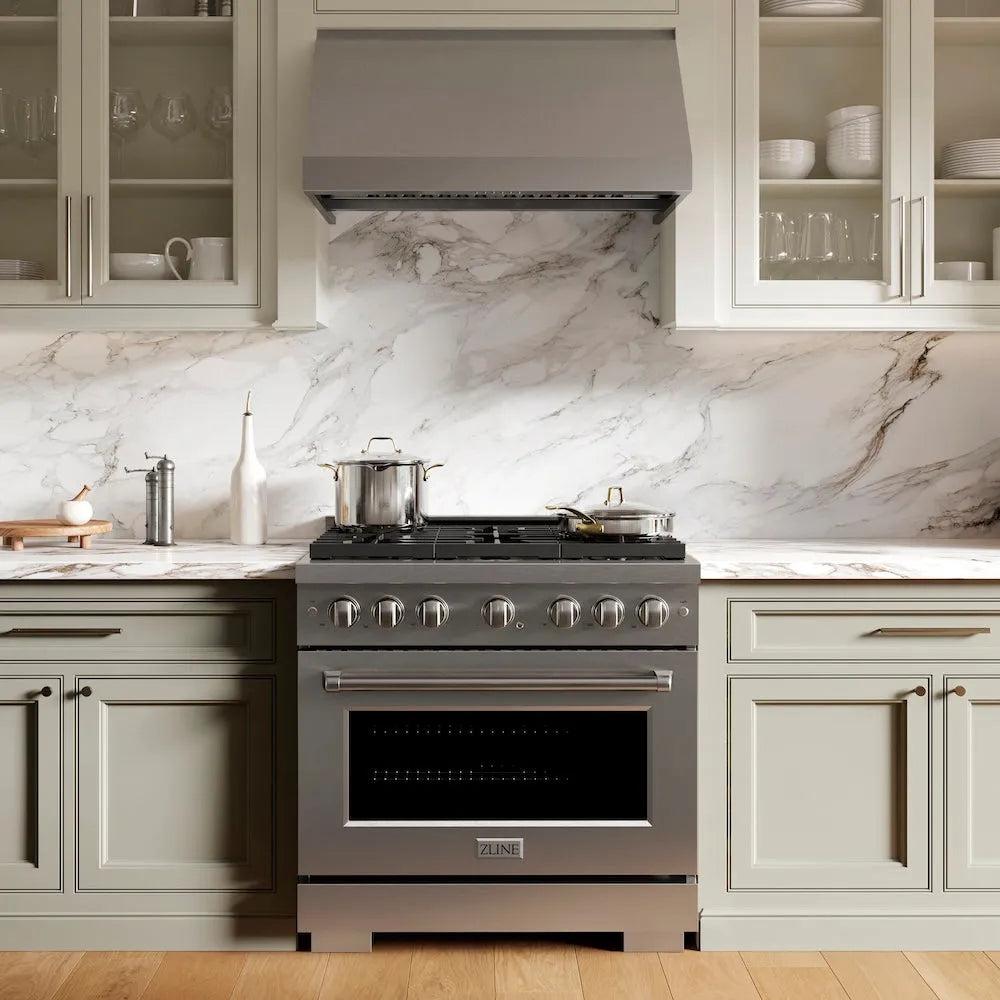 Modern kitchen with ZLINE 36 in. 5.2 cu. ft. Paramount Gas Range with 6 Burner Cooktop and Convection Gas Oven in Stainless Steel (SGR36) and marble backsplash
