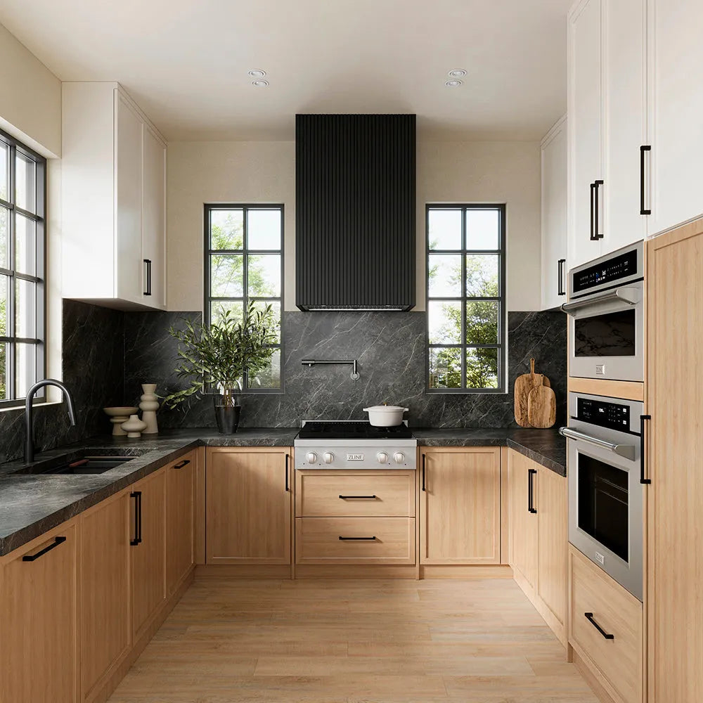 ZLINE 28 in. DuraMount™ Wall Mount Range Hood Insert in Stainless Steel (683-28) in a designer kitchen with wooden cabinets, black countertops, and a custom black range hood.