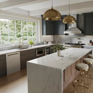Modern kitchen with marble island, ZLINE Autograph Edition 24 in. Tallac Series 3rd Rack Top Control Built-In Tall Tub Dishwasher in Stainless Steel with Champagne Bronze Handle, 51dBa (DWVZ-304-24-CB), and gold pendant lights.