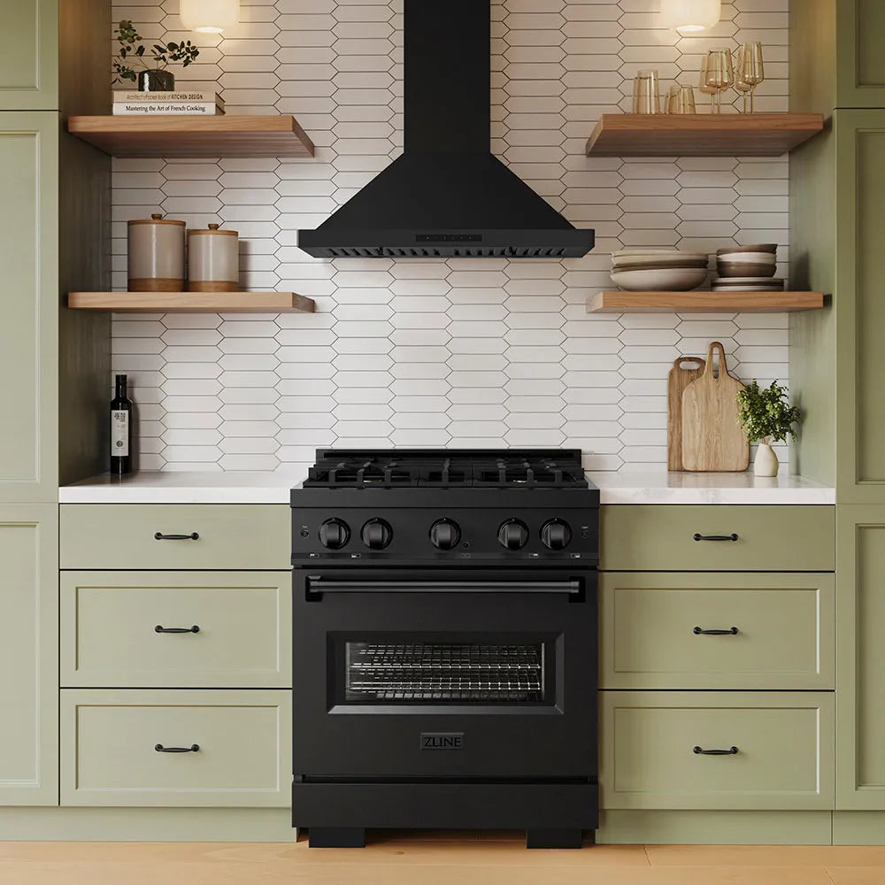 ZLINE 30 in. Convertible Vent Wall Mount Range Hood in Black Stainless Steel (BSKBN-30) above a black range in a kitchen with green cabinets and wooden shelves.