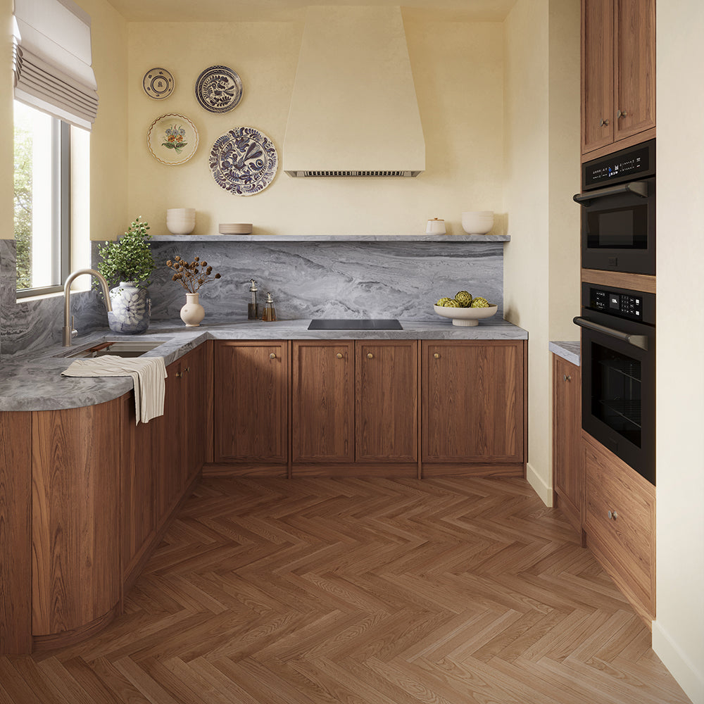 ZLINE 24 in. Induction Cooktop with Anti-Scratch Glass and 3 Elements (FCIND-24) in a modern L-shaped kitchen featuring warm medium-brown wood cabinets, a gray marble countertop and backsplash, a matching wood herringbone floor, and built-in black appliances.