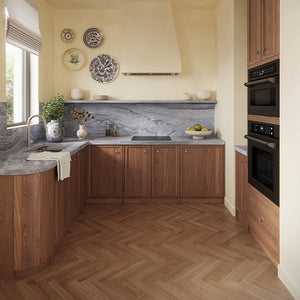 ZLINE 24 in. Induction Cooktop with Anti-Scratch Glass and 3 Elements (FCIND-24) in a modern L-shaped kitchen featuring warm medium-brown wood cabinets, a gray marble countertop and backsplash, a matching wood herringbone floor, and built-in black appliances.