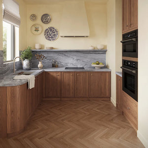 ZLINE 24 in. Induction Cooktop with Anti-Scratch Glass and 3 Elements (FCIND-24) in a modern L-shaped kitchen featuring warm medium-brown wood cabinets, a gray marble countertop and backsplash, a matching wood herringbone floor, and built-in black appliances.