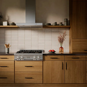 ZLINE 30 in. Classic Gas Rangetop with 4 Burner DuoPro™ Cooktop in Stainless Steel (PCRT30) in a luxury kitchen with wooden cabinets, stainless steel range hood, and decorative elements.