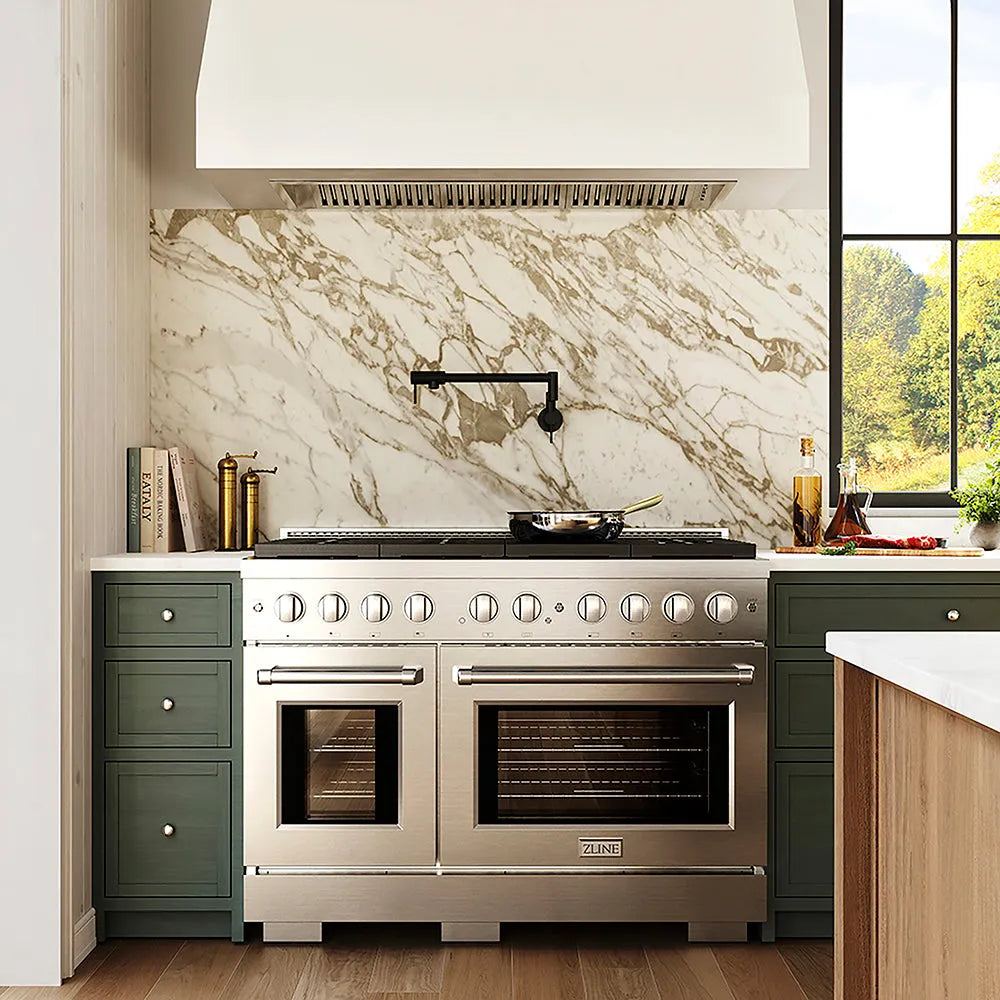 ZLINE 48 in. 6.7 cu. ft. Paramount Dual Fuel Range with 8 Burner DuoPro™ Cooktop and Dual Ovens in Stainless Steel (PSDR48) in a luxury kitchen with window view, white marble backsplash, and green cabinets.