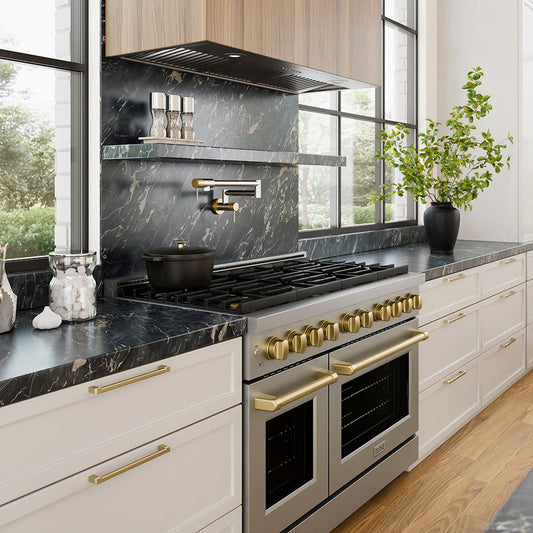 ZLINE 46 in. DuraMount™ Wall Mount Range Hood Insert in Stainless Steel (683-46) in a designer kitchen with marble backsplash, custom range hood, and decorative elements, side.
