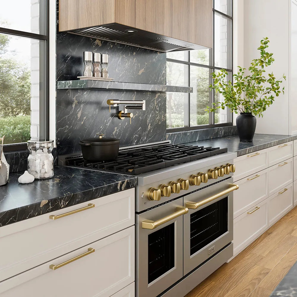 ZLINE 46 in. DuraMount™ Wall Mount Range Hood Insert in Stainless Steel (683-46) in a designer kitchen with marble backsplash, custom range hood, and decorative elements, side.
