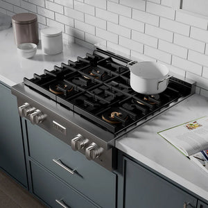 ZLINE 30 in. Paramount Gas Rangetop with 4 Burner DuoPro™ Cooktop in Stainless Steel (PSRT30) in a luxury kitchen with white marble backsplash and white cabinets, side.