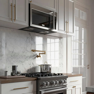 ZLINE 30 in. Stainless Steel Over the Range Convection Microwave Oven with Traditional Handle (MWO-OTR-H-30) in a white marble kitchen with wood details.