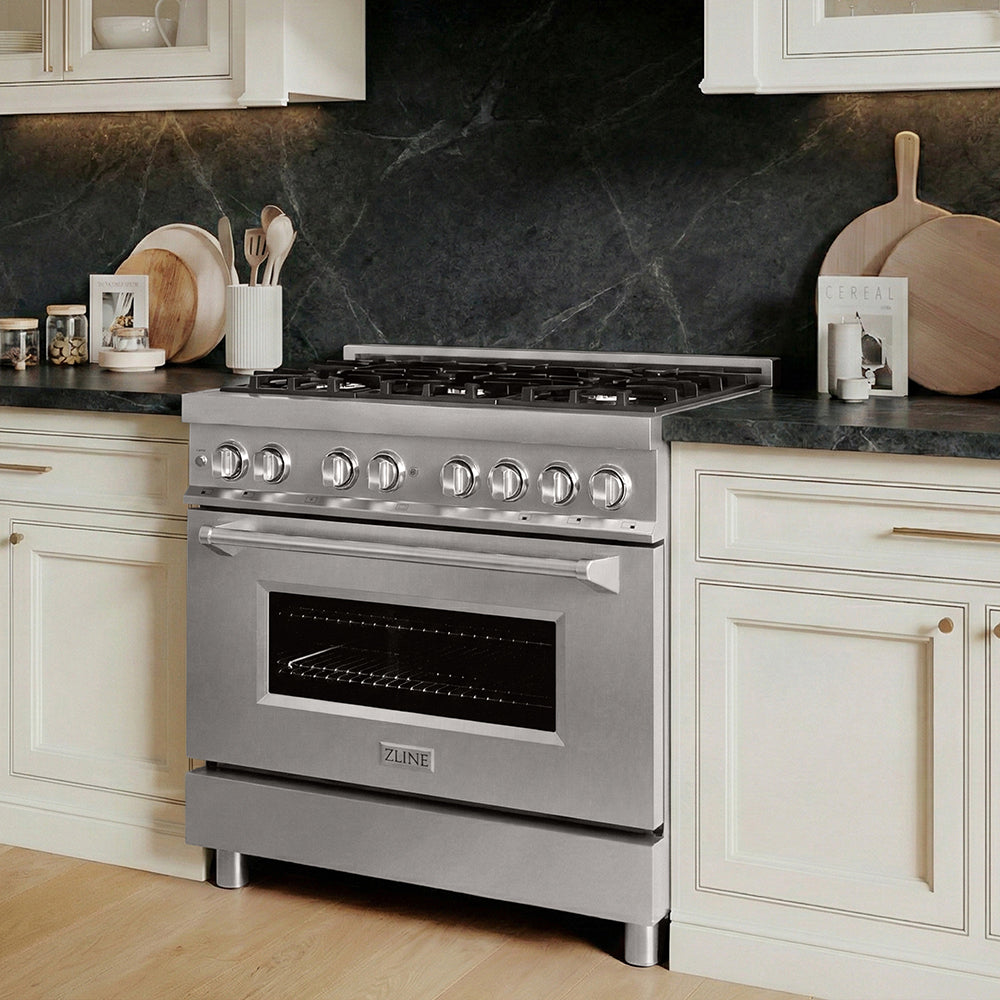 ZLINE 36 in. 4.6 cu. ft. Legacy Dual Fuel Range with 6 Burner Gas Cooktop and Electric Convection Oven in Stainless Steel (RA36) in a kitchen with marble backsplash and wooden flooring