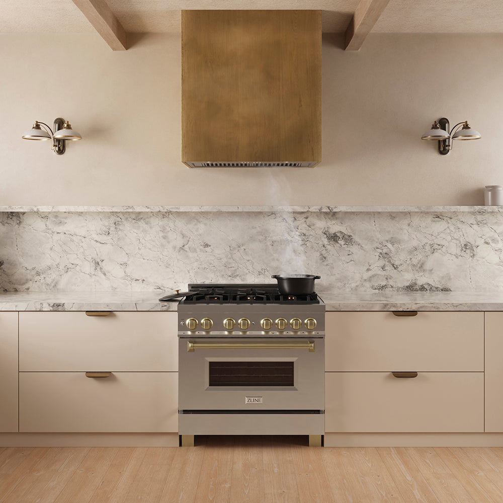 ZLINE 34 in. DuraMount™ Wall Mount Range Hood Insert in Stainless Steel (683-34) in a designer kitchen with a custom wood range hood above a stainless steel range,