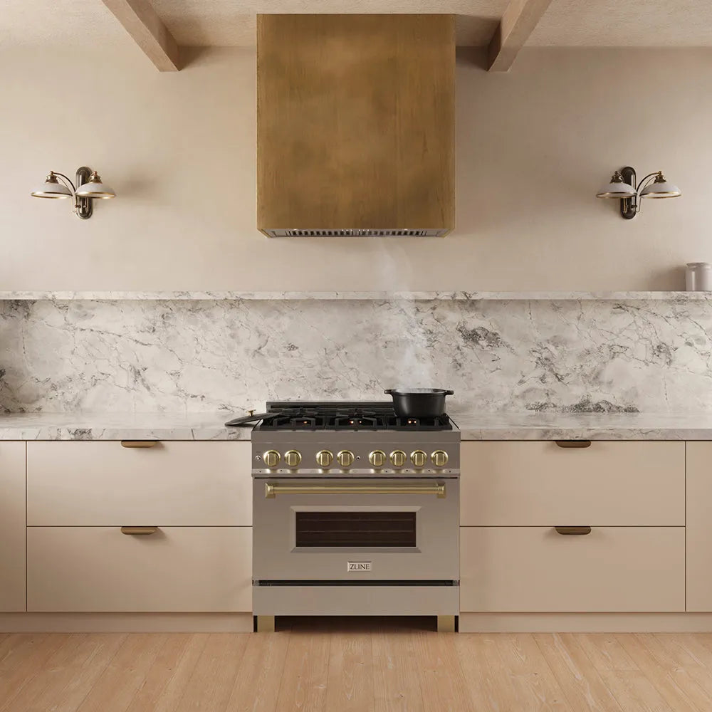 ZLINE 34 in. DuraMount™ Wall Mount Range Hood Insert in Stainless Steel (683-34) in a designer kitchen with a custom wood range hood above a stainless steel range,