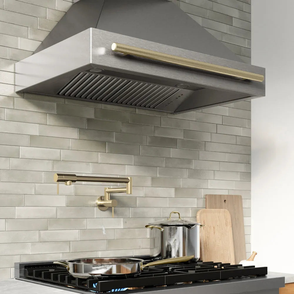 ZLINE Autograph Edition 36 in. Wall-Mount Range Hood Helix Handle (Set of 1) in Champagne Bronze (RHHZ-K-CB-36) installed in a designer kitchen.