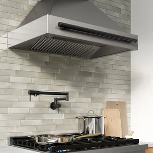 ZLINE Autograph Edition 36 in. Wall-Mount Range Hood Helix Handle (Set of 1) in Matte Black (RHHZ-K-MB-36) installed in a designer kitchen.