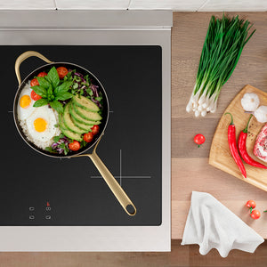 ZLINE 30 in. 4.2 cu. ft. Paramount Induction Range with 4 Element Cooktop and Electric Convection Oven in Stainless Steel with White Matte Door (SINR-WM-30) top-down, induction cooktop with a pan of food and ingredients on a wooden countertop
