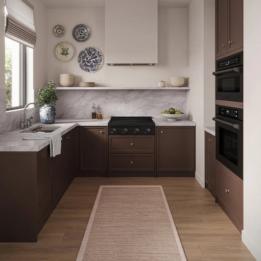 A designer kitchen interior with dark brown cabinetry, white marble countertops, a beige rug, wood flooring, ZLINE 30 in. Paramount Induction Rangetop with 4 Element Cooktop in Black Stainless Steel (SINRTB-30), and decorative wall plates.