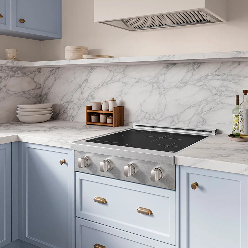 ZLINE 30 in. Paramount Induction Rangetop with 4 Element Cooktop in Satin Stainless Steel (SINRTS-30) in a designer kitchen with marble backsplash, light blue cabinets, angled.
