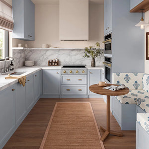ZLINE Autograph Edition 30 in. Paramount Induction Rangetop with 4 Element Cooktop in Stainless Steel and Champagne Bronze Accents (SINRTZ-30-CB) in a designer kitchen with gray cabinets, marble countertop, and wooden floor, front.