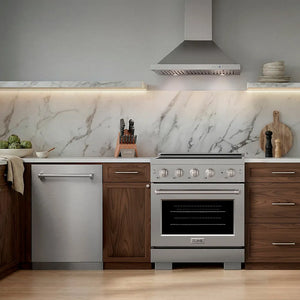 A modern kitchen scene featuring a stainless steel freestanding gas range with a ZLINE 30 in. Convertible Vent Wall Mount Range Hood in Stainless Steel (KB-30), a matching dishwasher, dark wood cabinets, and a white marble backsplash.