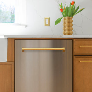 A ZLINE Autograph Edition 24 in. Monument Series 3rd Rack Dishwasher with Auto Door Open Drying, 44dBa, Stainless Steel Panel with Polished Gold Handle (DWMTZ-304-24-G) installed under a white marble countertop in a modern kitchen with wood cabinets and a vase of tulips.