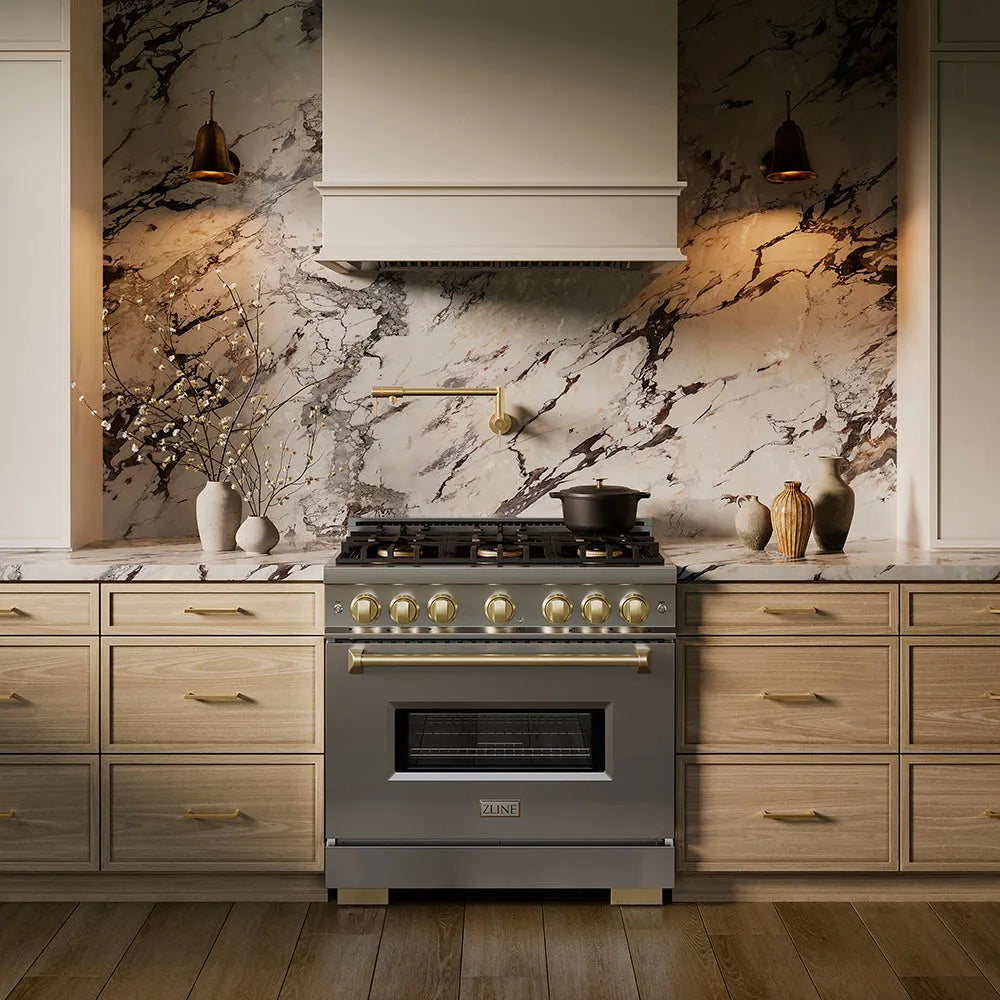 ZLINE Autograph Edition 36 in. 5.2 cu. ft. Classic Dual Fuel Range with 6 Burner DuoPro™ Cooktop and Electric Convection Oven in Stainless Steel and Champagne Bronze Accents (PCDRZ-36-CB) in a custom kitchen against a marble backsplash, front.