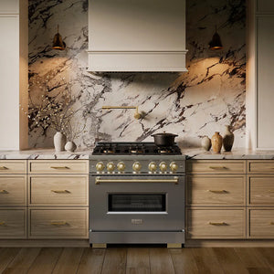 ZLINE Autograph Edition 36 in. 5.2 cu. ft. Classic Dual Fuel Range with 6 Burner DuoPro™ Cooktop and Electric Convection Oven in Stainless Steel and Champagne Bronze Accents (PCDRZ-36-CB) in a custom kitchen against a marble backsplash, front.