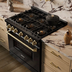 ZLINE Autograph Edition 36 in. 5.2 cu. ft. Classic Gas Range with 6 Burner DuoPro™ Cooktop and Convection Gas Oven in Black Stainless Steel and Champagne Bronze Accents (PCGRBZ-36-CB) in a custom kitchen against a marble backsplash, side, above cooktop.