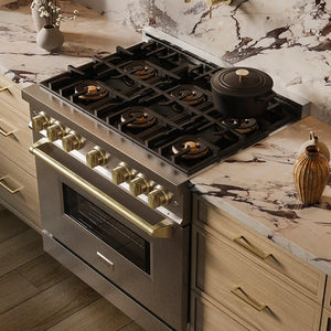 ZLINE Autograph Edition 36 in. 5.2 cu. ft. Classic Gas Range with 6 Burner DuoPro™ Cooktop and Convection Gas Oven in Satin Stainless Steel and Champagne Bronze Accents (PCGRSZ-36-CB) in a custom kitchen against a marble backsplash, side, above cooktop.