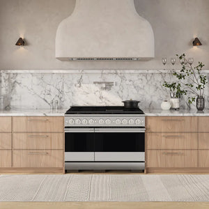 ZLINE 48 in. 6.7 cu. ft. Marino Dual Fuel Range with 8 Burner DuoPro™ Cooktop and Dual Ovens in Stainless Steel (PMDR48) side, set in a modern kitchen with light wood cabinets, a white marble backsplash, and a textured beige rug.
