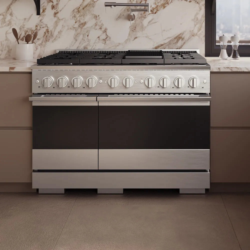 ZLINE 48 in. 6.7 cu. ft. Marino Dual Fuel Range with 8 Burner Gas Cooktop and Dual Ovens in Stainless Steel (MDR48) front, set in a modern kitchen with beige cabinets and a marble backsplash.