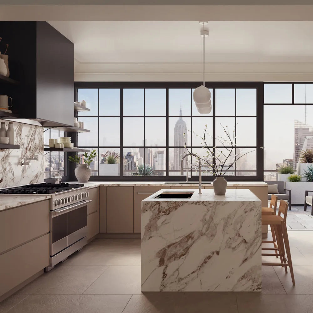 ZLINE 48 in. 6.7 cu. ft. Marino Gas Range with 8 Burner DuoPro™ Cooktop and Dual Ovens in Stainless Steel (PMGR48), set in a modern kitchen with beige cabinets, a large marble island, dark cabinetry, and expansive windows overlooking a city skyline.