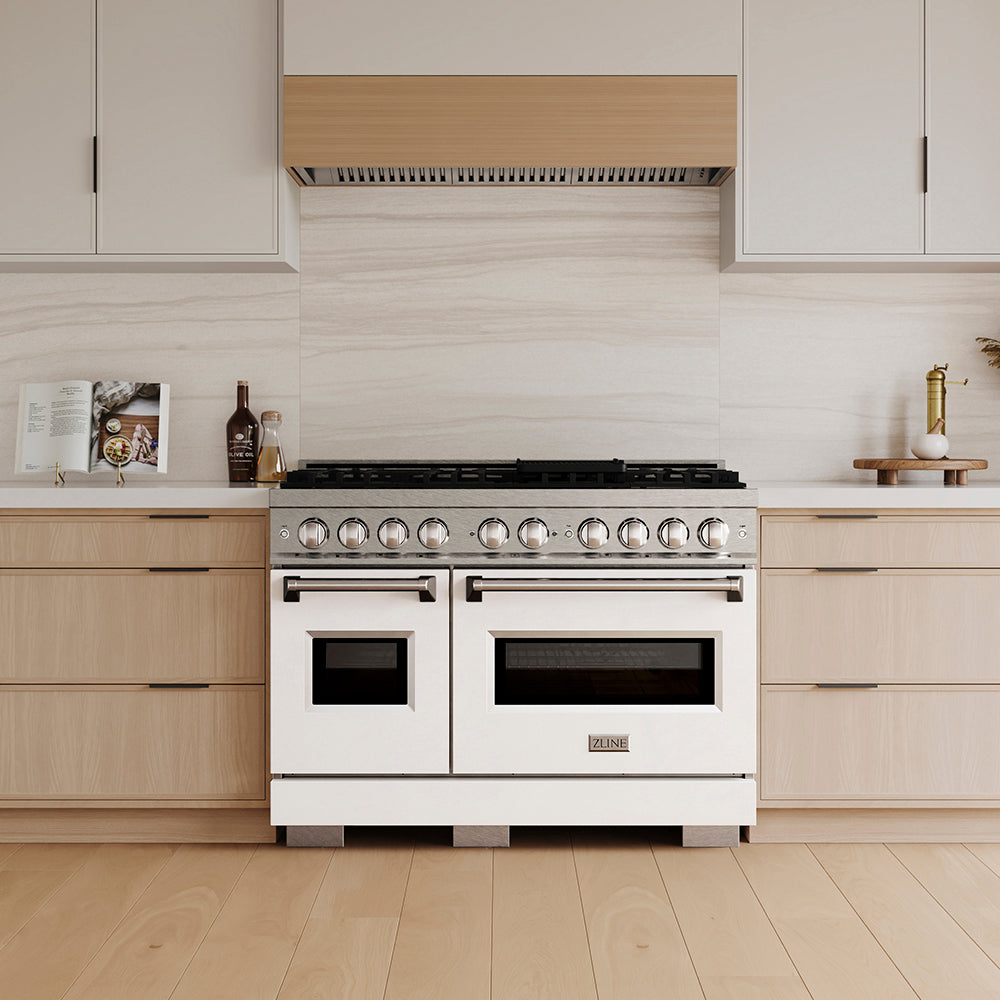 ZLINE 48 in. 6.7 cu. ft. Classic Dual Fuel Range with 8 Burner DuoPro™ Cooktop and Dual Ovens in Satin Stainless Steel with White Matte Doors (PCDRS-WM-48) in a custom kitchen with wooden cabinets and white walls, front.