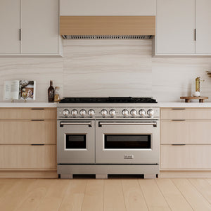 ZLINE 48 in. 6.7 cu. ft. Classic Gas Range with 8 Burner DuoPro™ Cooktop and Dual Ovens in Stainless Steel (PCGR48) in a custom kitchen with wooden cabinets and white walls, front.