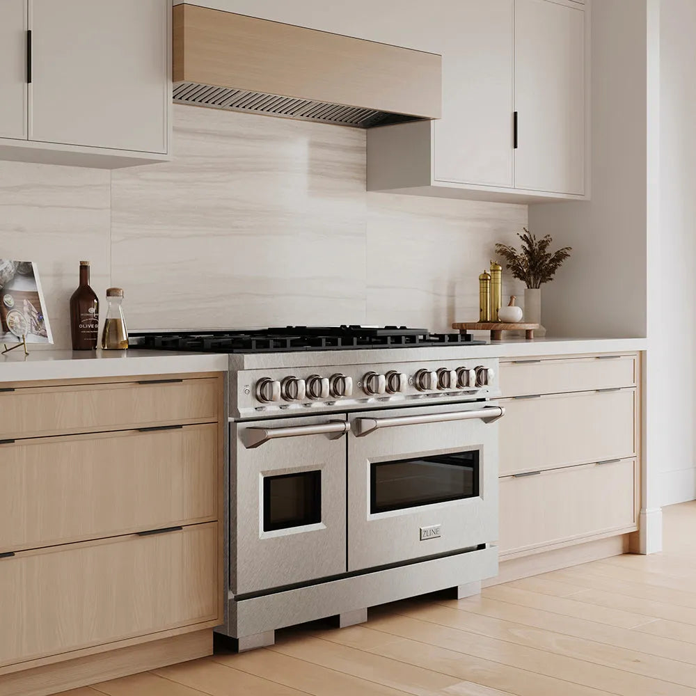 ZLINE 48 in. 6.7 cu. ft. Classic Dual Fuel Range with 8 Burner DuoPro™ Cooktop and Dual Ovens in Satin Stainless Steel (PCDRS-48) in a custom kitchen with wooden cabinets and white walls, side.