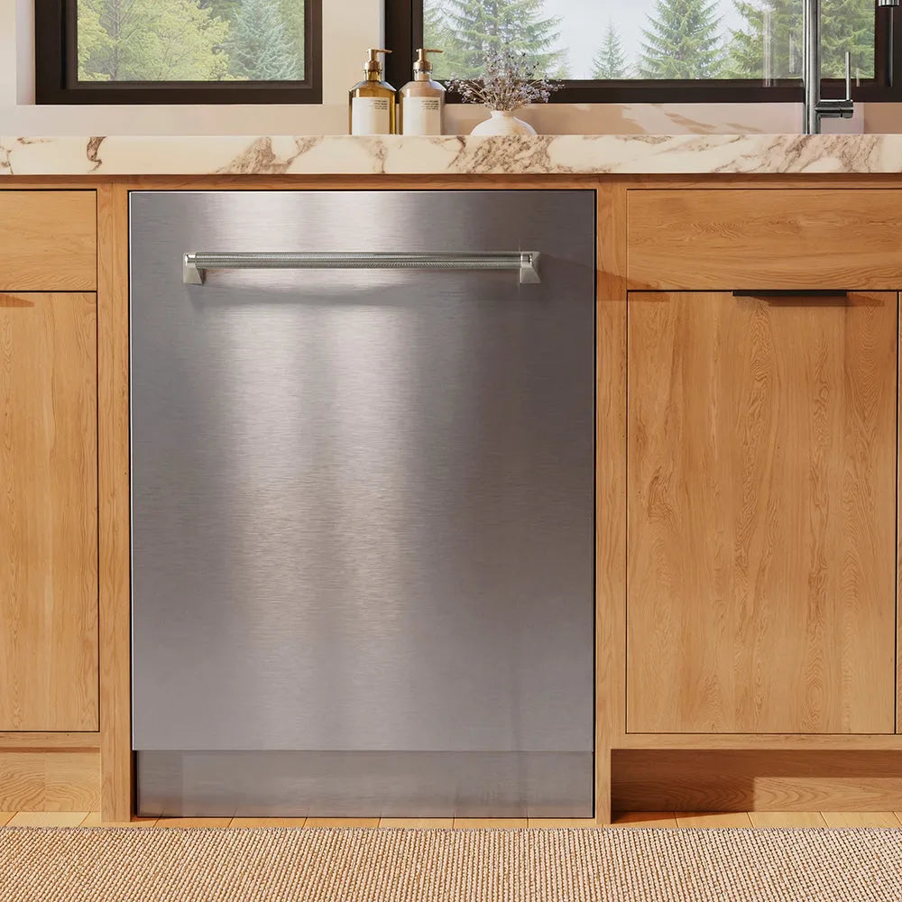 ZLINE Autograph Edition 24 in. Monument Series 3rd Rack Dishwasher with Auto Door Open Drying, 44dBa, Stainless Steel Panel with Polished Nickel Helix Handle (DWMTZ-30424-KPN) front, in a kitchen with wooden cabinets and a window view.