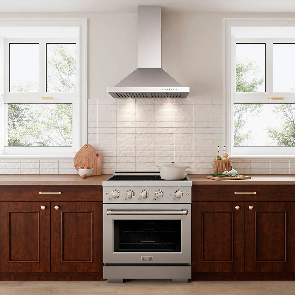 Luxury compact kitchen with stainless steel induction range and ZLINE 30 in. Convertible Vent Wall Mount Range Hood in Stainless Steel (KB-30)