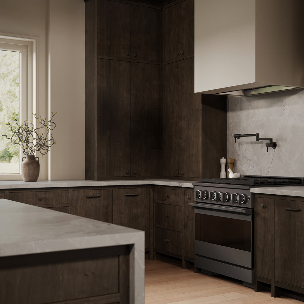 ZLINE 36 in. 5.2 cu. ft. Marino Dual Fuel Range with Gas Cooktop and Electric Convection Oven in Black Stainless Steel with 6 Brass Burners (MDRB-BR-36) side, in a modern kitchen with dark wood cabinetry, light stone countertops, a large white range hood, and a window on the left.