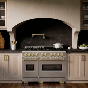 ZLINE Autograph Edition 48 in. 6.7 cu. ft. Classic Dual Fuel Range with 8 Burner DuoPro™ Cooktop and Dual Ovens in Satin Stainless Steel and Champagne Bronze Accents (PCDRSZ-48-CB) in a custom kitchen with marble backsplash and large range hood, front.