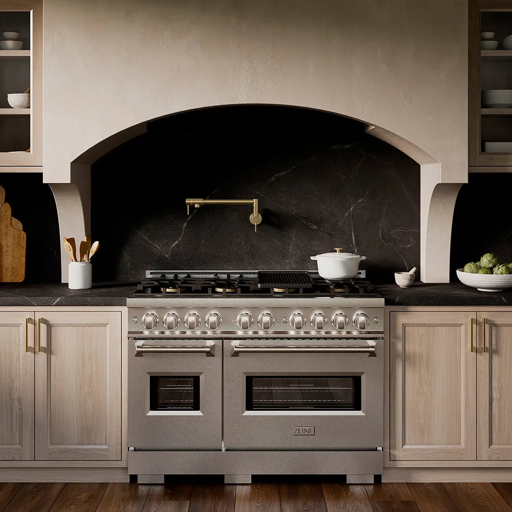 ZLINE 48 in. 6.7 cu. ft. Classic Gas Range with 8 Burner DuoPro™ Cooktop and Dual Ovens in Satin Stainless Steel (PCGRS-48) in a custom kitchen with marble backsplash and large range hood, front.