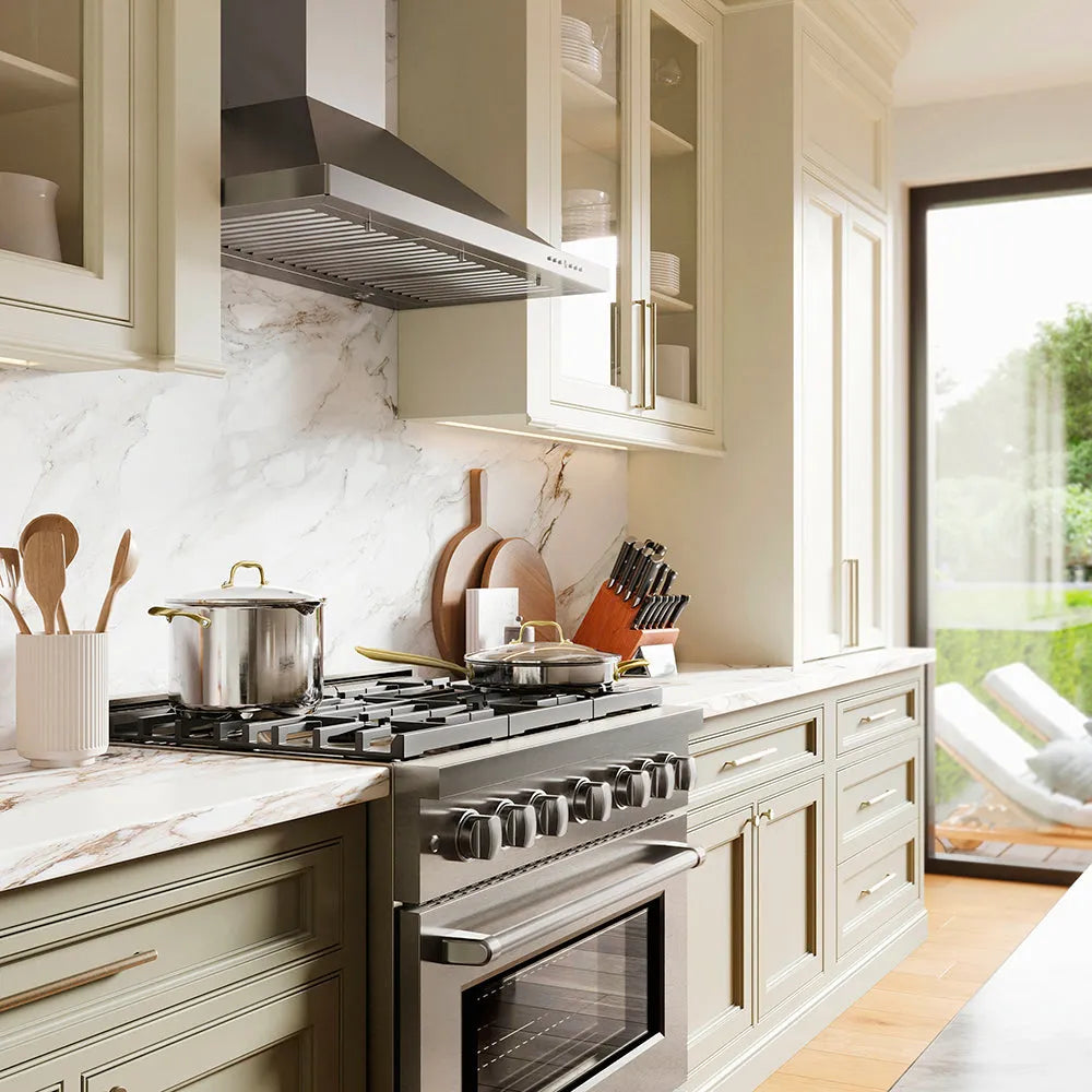 ZLINE 36 in. Convertible Vent Wall Mount Range Hood in Stainless Steel (KB-36) in a kitchen with stainless steel appliances and marble countertops