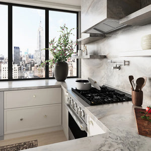 ZLINE 30 in. 4.2 cu. ft. Marino Dual Fuel Range with 4 Burner Gas Cooktop and Electric Convection Oven in Stainless Steel (MDR30) side, set in a modern kitchen with white cabinetry, marble countertops, a large window overlooking a city skyline, and a potted plant on the counter.