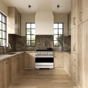 ZLINE 36 in. 5.2 cu. ft. Marino Dual Fuel Range with 6 Burner Gas Cooktop and Electric Convection Oven in Stainless Steel with White Matte Door (MDR-WM-36) front, set in a modern kitchen with light wood cabinets, a textured stone backsplash, and a black pot on the cooktop.