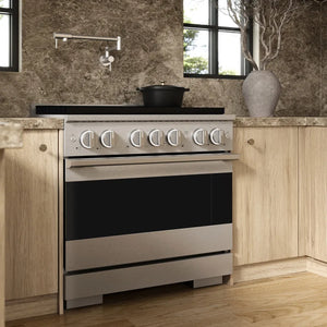 ZLINE 36 in. 5.2 cu. ft. Marino Dual Fuel Range with 6 Burner Gas Cooktop and Electric Convection Oven in Satin Stainless Steel (MDRS-36) side, set in a modern kitchen with light wood cabinets, a textured stone backsplash, and a black pot on the cooktop.