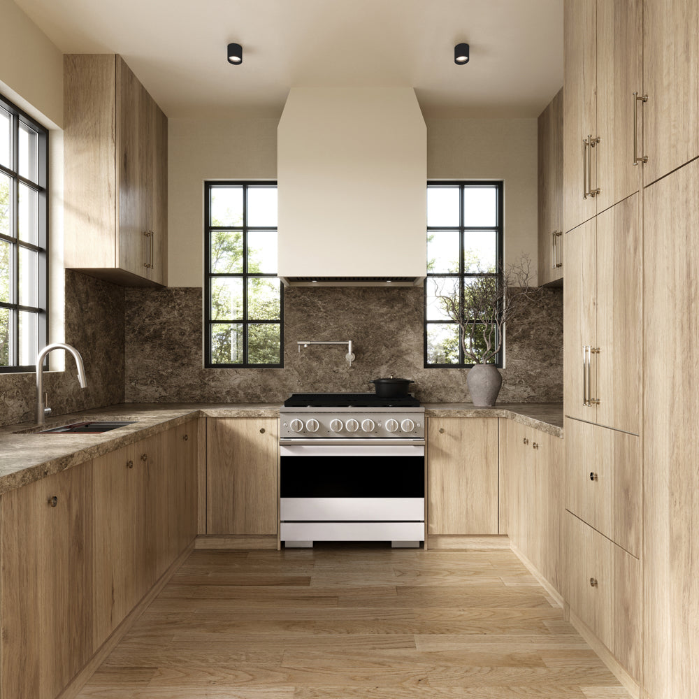 ZLINE 36 in. 5.2 cu. ft. Marino Gas Range with 6 Burner Cooktop and Convection Gas Oven in Stainless Steel with White Matte Door (MGR-WM-36) front, set in a modern kitchen with light wood cabinets, a textured stone backsplash, and a black pot on the cooktop.