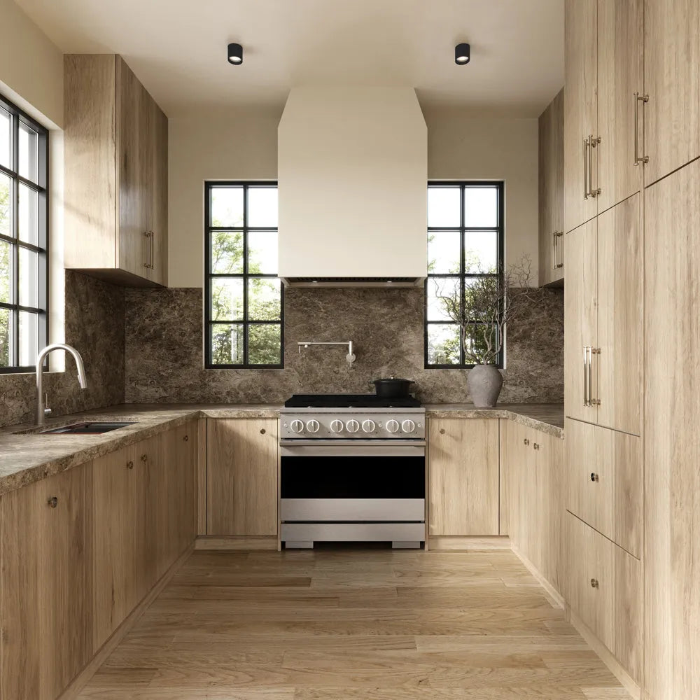 ZLINE 36 in. 5.2 cu. ft. Marino Gas Range with 6 Burner Cooktop and Convection Gas Oven in Satin Stainless Steel (MGRS-36) front, set in a modern kitchen with light wood cabinets, a textured stone backsplash, and a black pot on the cooktop.