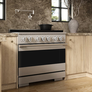 ZLINE 36 in. 5.2 cu. ft. Marino Gas Range with Convection Gas Oven in Satin Stainless Steel with 6 Brass Burners (MGRS-BR-36) side, set in a modern kitchen with light wood cabinets, a textured stone backsplash, and a black pot on the cooktop.